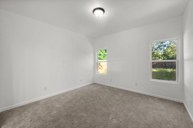 710 E 3rd Ave, Corsicana, TX 75110 - carpeted empty room with baseboards