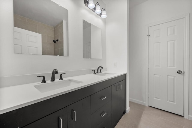 710 E 3rd Ave, Corsicana, TX 75110 - full bath featuring tile patterned flooring, double vanity, and baseboards