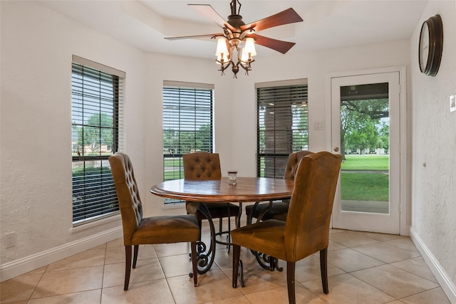 120 Willow Oak Ct, Double Oak, TX 75077 - dining space featuring a textured wall, healthy amount of natural light, baseboards, a ceiling fan, and light tile patterned floors