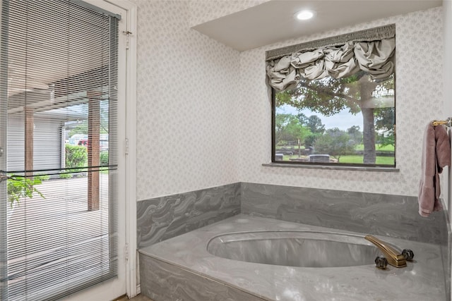 120 Willow Oak Ct, Double Oak, TX 75077 - bathroom featuring wallpapered walls, a garden tub, and plenty of natural light