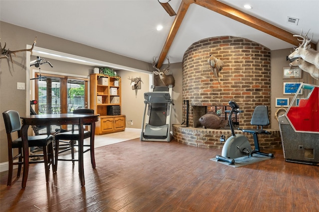 120 Willow Oak Ct, Double Oak, TX 75077 - dining area featuring a brick fireplace, wood finished floors, baseboards, and brick wall