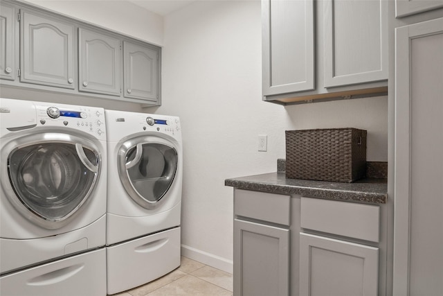 120 Willow Oak Ct, Double Oak, TX 75077 - laundry area featuring cabinet space, washer and clothes dryer, light tile patterned flooring, and baseboards
