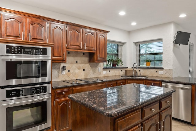 120 Willow Oak Ct, Double Oak, TX 75077 - kitchen with stainless steel appliances, a sink, backsplash, dark stone counters, and recessed lighting
