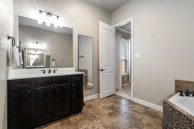 958 Prairie Timber Rd, Burleson, TX 76028 - full bath featuring vanity, tiled bath, and baseboards