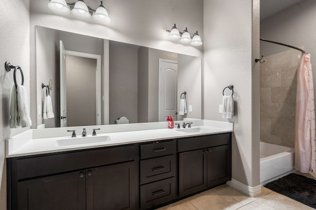 958 Prairie Timber Rd, Burleson, TX 76028 - full bath with double vanity, tile patterned floors, shower / tub combo with curtain, and a textured wall