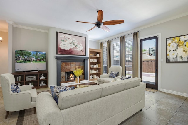11212 Sunrise Ln, Frisco, TX 75035 - tiled living room with a ceiling fan, ornamental molding, baseboards, and a fireplace