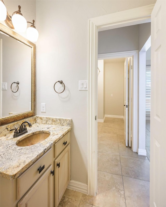 11212 Sunrise Ln, Frisco, TX 75035 - bathroom featuring vanity, baseboards, and tile patterned flooring