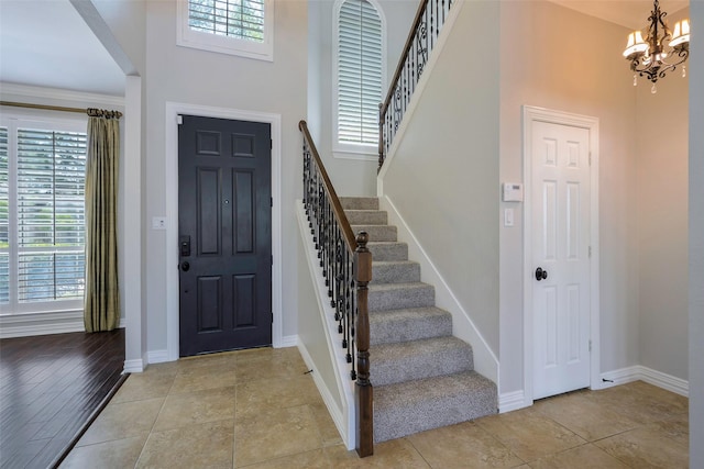11212 Sunrise Ln, Frisco, TX 75035 - entryway with stairway, a chandelier, plenty of natural light, and a high ceiling