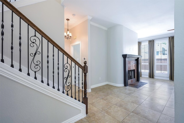 11212 Sunrise Ln, Frisco, TX 75035 - stairs with a chandelier, a tile fireplace, tile patterned floors, baseboards, and ornamental molding
