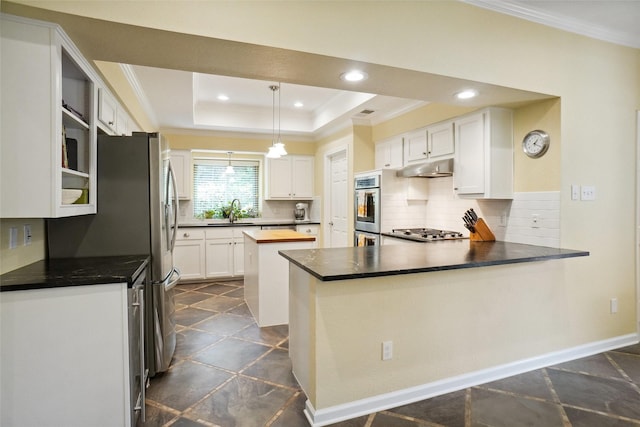 731 Falcon Ln, Coppell, TX 75019 - kitchen featuring crown molding, a sink, white cabinets, a tray ceiling, and under cabinet range hood