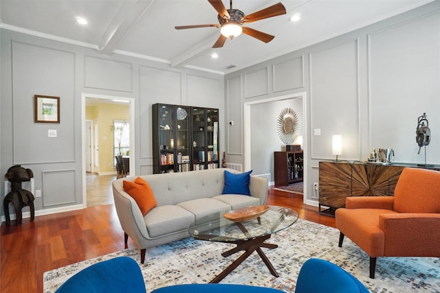 731 Falcon Ln, Coppell, TX 75019 - living area featuring a decorative wall, a ceiling fan, wood finished floors, beamed ceiling, and crown molding