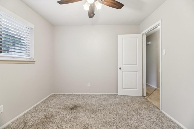 611 Buffalo Dr, Arlington, TX 76013 - empty room with a ceiling fan, light colored carpet, and baseboards