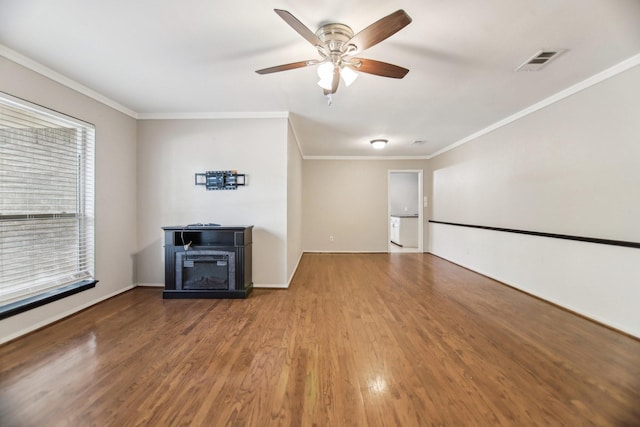 611 Buffalo Dr, Arlington, TX 76013 - unfurnished living room featuring wood finished floors, a ceiling fan, ornamental molding, and baseboards
