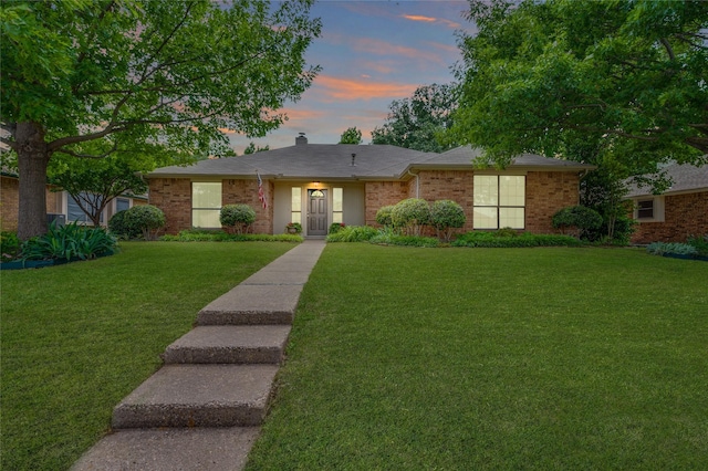 1404 Chicota Dr, Plano, TX 75023 - ranch-style home featuring a lawn, a chimney, and brick siding