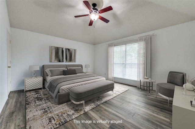 1404 Chicota Dr, Plano, TX 75023 - bedroom with wood finished floors, baseboards, ceiling fan, and lofted ceiling