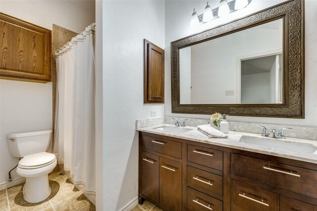 1404 Chicota Dr, Plano, TX 75023 - full bathroom with double vanity, toilet, baseboards, tile patterned flooring, and curtained shower