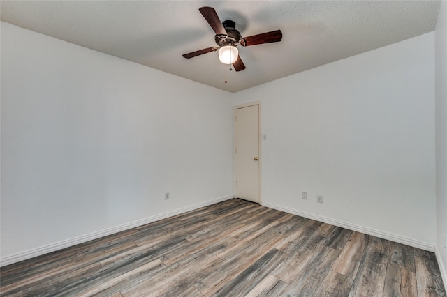1404 Chicota Dr, Plano, TX 75023 - spare room featuring wood finished floors, a ceiling fan, and baseboards