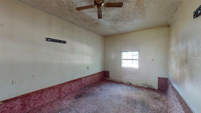 3243 Arizona Ave, Dallas, TX 75216 - spare room with a textured ceiling, a ceiling fan, and carpet