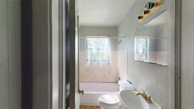 3243 Arizona Ave, Dallas, TX 75216 - bathroom with toilet, a textured wall, and shower / bathtub combination