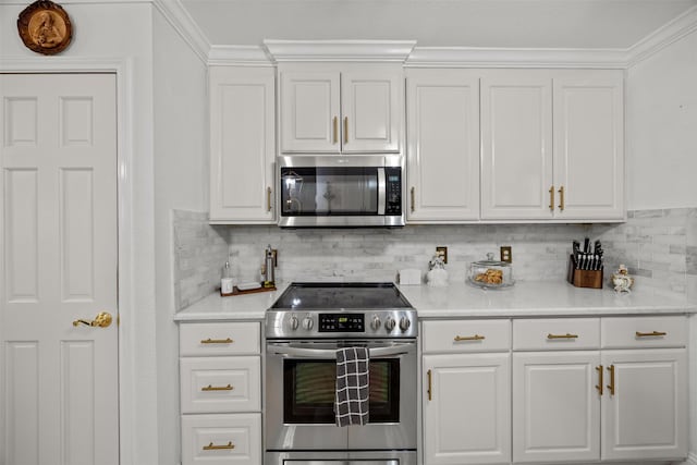5637 Hunters Bend Ln, Dallas, TX 75249 - kitchen featuring stainless steel appliances, white cabinets, decorative backsplash, light countertops, and crown molding