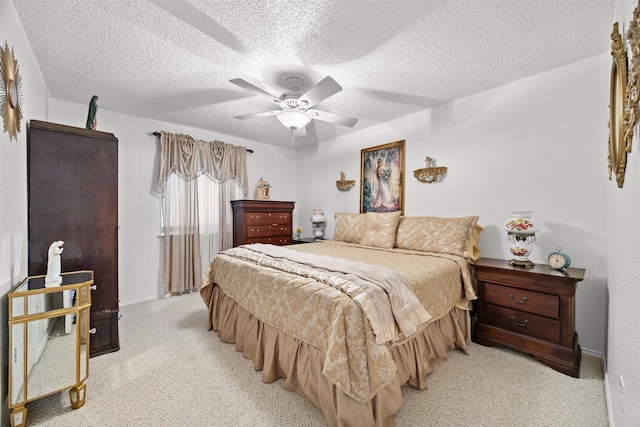 5637 Hunters Bend Ln, Dallas, TX 75249 - bedroom with light carpet, a textured ceiling, ceiling fan, and baseboards