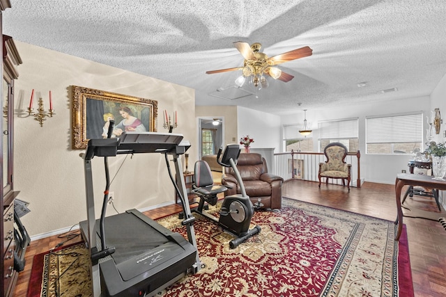 5637 Hunters Bend Ln, Dallas, TX 75249 - workout room featuring ceiling fan, wood finished floors, a textured ceiling, and healthy amount of natural light