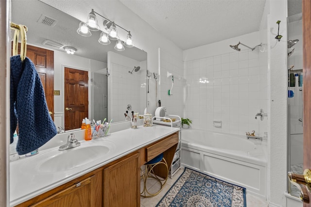 5637 Hunters Bend Ln, Dallas, TX 75249 - full bath featuring a textured ceiling, vanity, tile patterned flooring, and bathing tub / shower combination