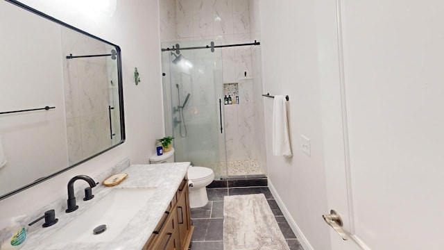 330 Austin Unit 313, Waco, TX 76701 - bathroom featuring a marble finish shower, toilet, vanity, and baseboards