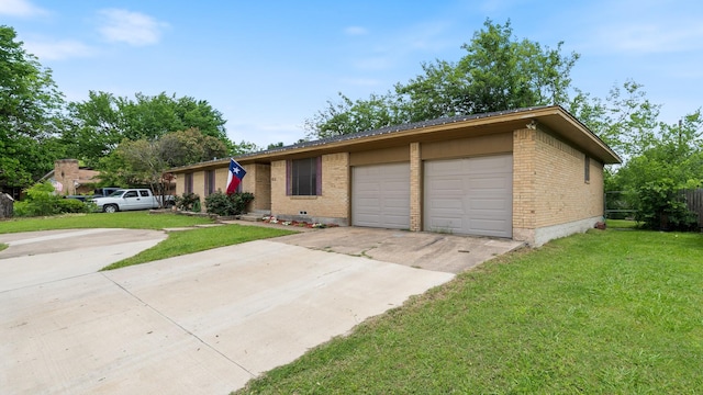 413 E 9th St, Kaufman, TX 75142 - view of front of home featuring brick siding, driveway, and a front lawn