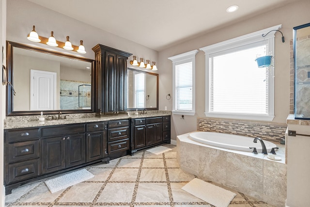 781 Audra Cir, Rhome, TX 76078 - bathroom with a garden tub, a tile shower, double vanity, tile patterned floors, and recessed lighting