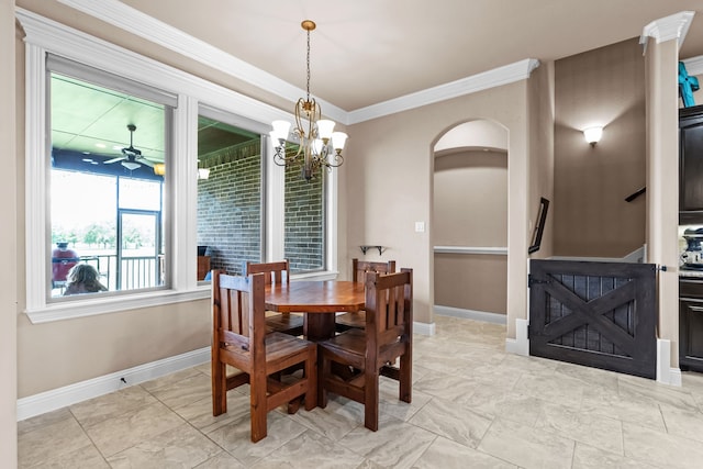 781 Audra Cir, Rhome, TX 76078 - dining room with crown molding, baseboards, a chandelier, ceiling fan, and arched walkways