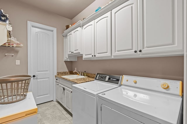 781 Audra Cir, Rhome, TX 76078 - clothes washing area with cabinet space, washer and clothes dryer, and light marble finish flooring
