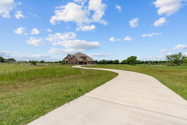 781 Audra Cir, Rhome, TX 76078 - view of community featuring a rural view, a lawn, and driveway