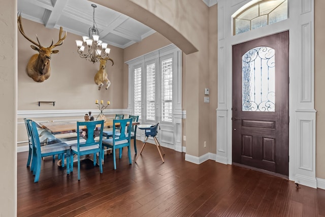 781 Audra Cir, Rhome, TX 76078 - foyer entrance with a chandelier, arched walkways, beamed ceiling, hardwood / wood-style floors, and coffered ceiling