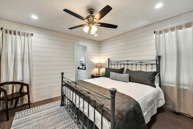 1116 Oakwood Ave, Waco, TX 76706 - bedroom featuring wood finished floors, wood walls, recessed lighting, a ceiling fan, and ensuite bath