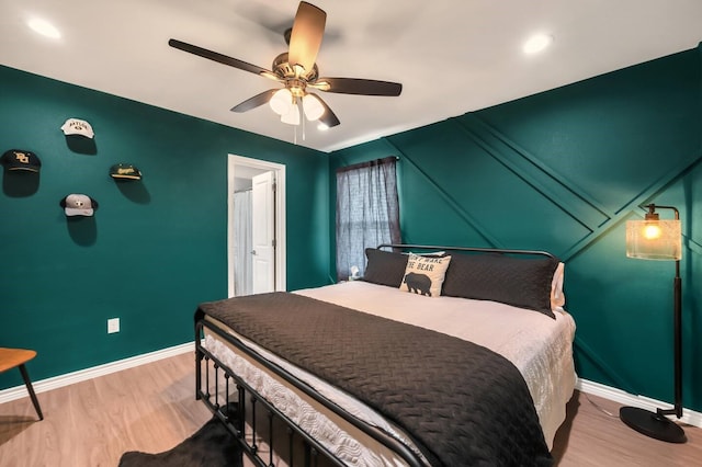 1116 Oakwood Ave, Waco, TX 76706 - bedroom with wood finished floors, baseboards, and ceiling fan