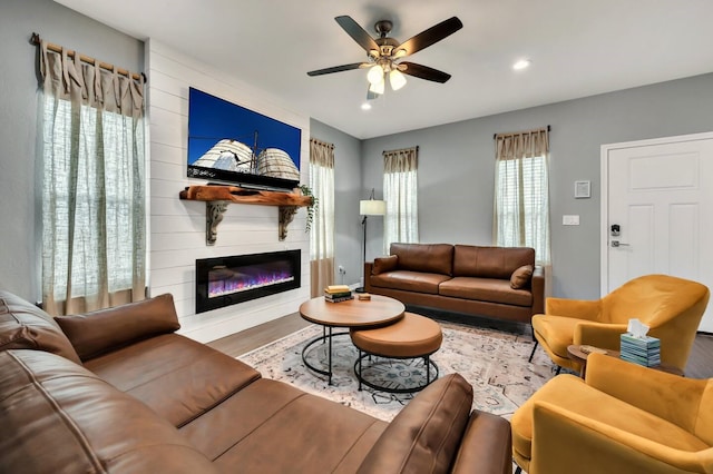 1116 Oakwood Ave, Waco, TX 76706 - living room with wood finished floors, a ceiling fan, a large fireplace, recessed lighting, and baseboards