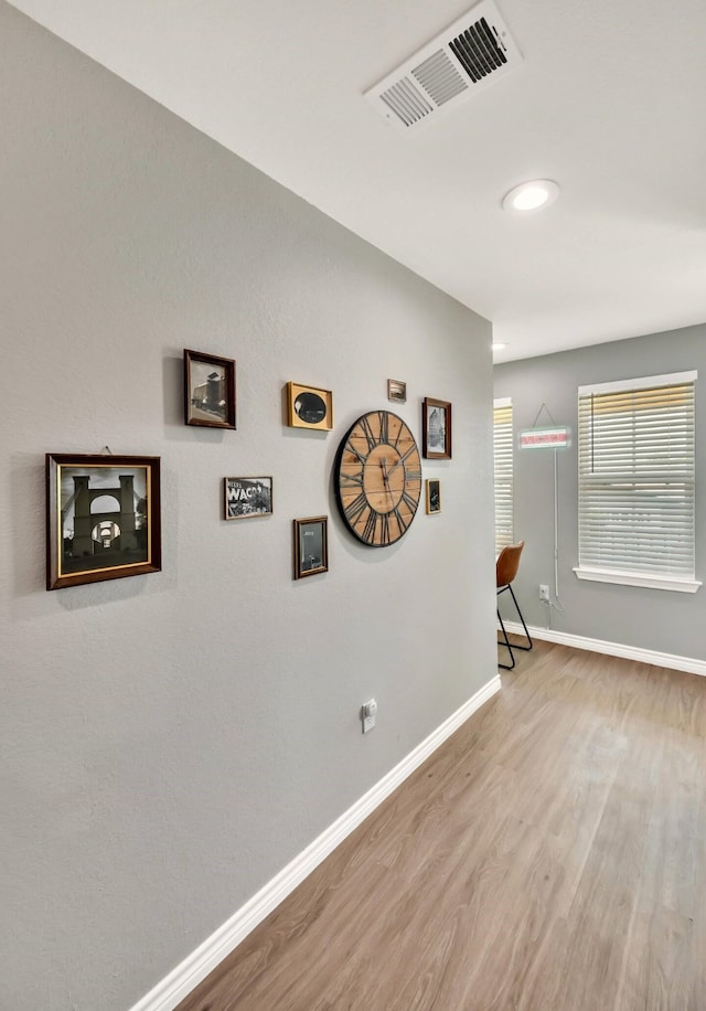 1116 Oakwood Ave, Waco, TX 76706 - hall featuring wood finished floors, baseboards, and recessed lighting