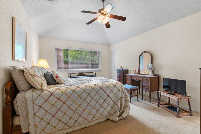 5502 Misty Crest Dr, Arlington, TX 76017 - bedroom featuring vaulted ceiling, carpet floors, ceiling fan, and a textured ceiling