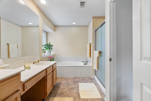 5502 Misty Crest Dr, Arlington, TX 76017 - full bath featuring a shower stall, vanity, a garden tub, recessed lighting, and a textured ceiling