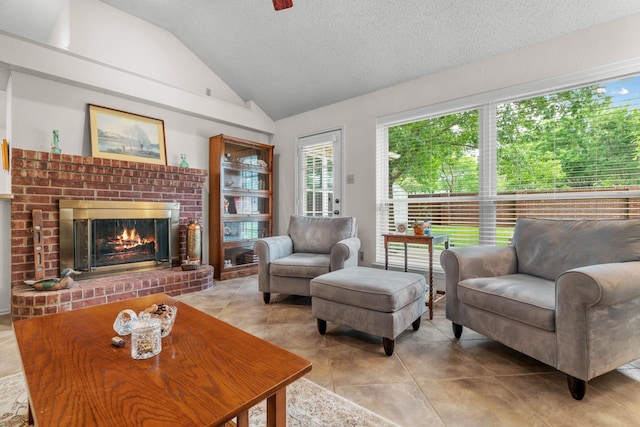 5502 Misty Crest Dr, Arlington, TX 76017 - living area with vaulted ceiling, a brick fireplace, a textured ceiling, and light tile patterned flooring