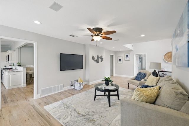 4636 Versailles Ln, Plano, TX 75093 - living room with ceiling fan, light wood-style floors, recessed lighting, and baseboards