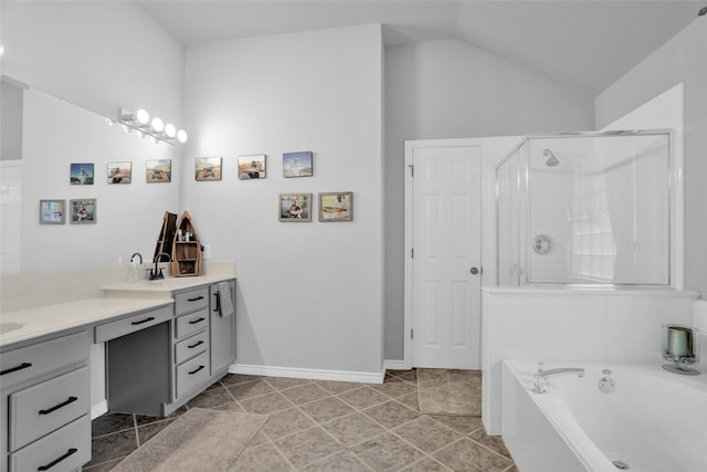 6105 Sidney Ln, Mckinney, TX 75070 - full bathroom featuring double vanity, a garden tub, a stall shower, lofted ceiling, and tile patterned floors