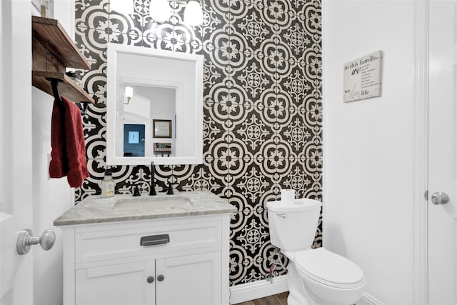 6105 Sidney Ln, Mckinney, TX 75070 - bathroom with toilet, vanity, and baseboards