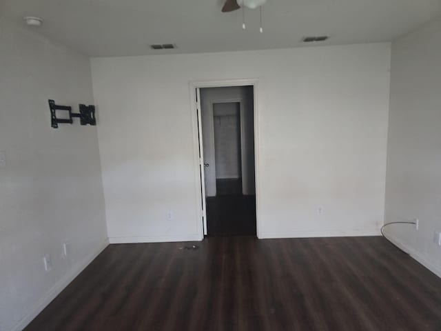 1322 Lucchese Ln, Dallas, TX 75253 - spare room with baseboards, dark wood finished floors, a ceiling fan, and a smoke detector