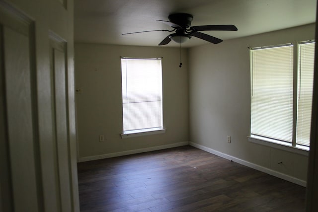 4207 Harrison St, Bellmead, TX 76705 - unfurnished room with healthy amount of natural light, a ceiling fan, and dark wood finished floors