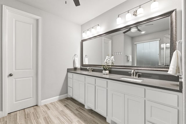 1319 Bridgewater Blvd, Celina, TX 75009 - full bath featuring ceiling fan, double vanity, baseboards, and wood finished floors