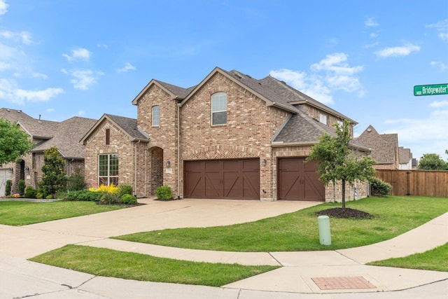 1319 Bridgewater Blvd, Celina, TX 75009 - traditional home featuring brick siding, driveway, an attached garage, and roof with shingles