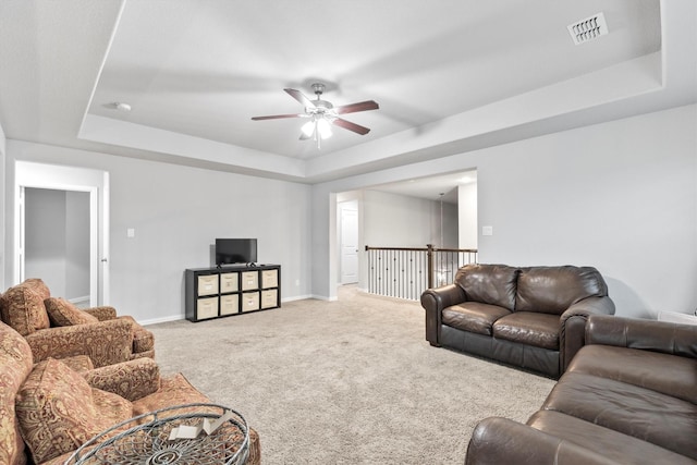 1319 Bridgewater Blvd, Celina, TX 75009 - living area featuring a tray ceiling, carpet floors, a ceiling fan, and baseboards