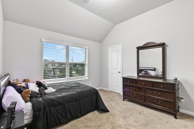 1319 Bridgewater Blvd, Celina, TX 75009 - bedroom with light carpet, lofted ceiling, and baseboards